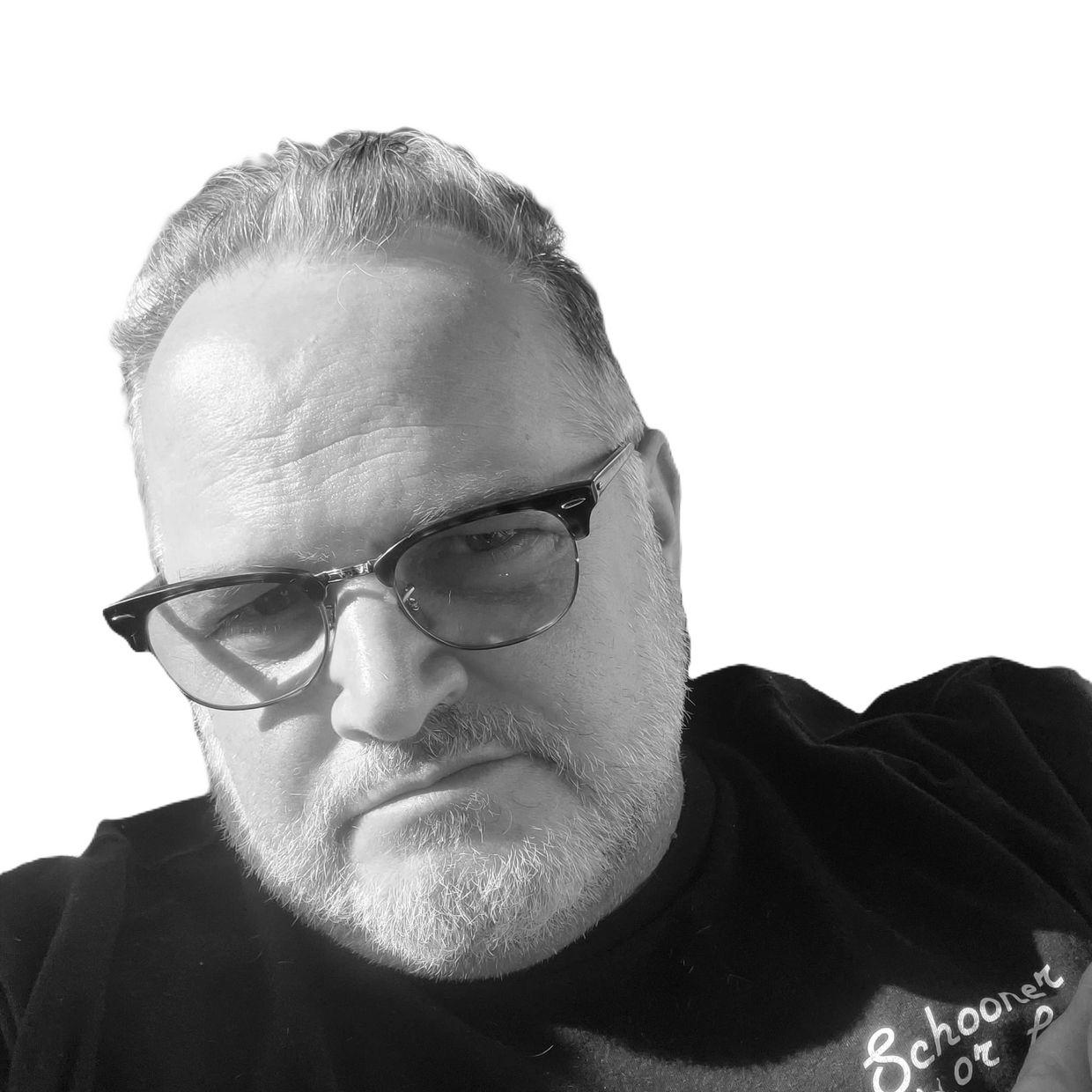 Black and white close-up of a man wearing glasses and a beard.