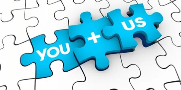 Blue puzzle pieces with 'You + Us' message fitting together.
