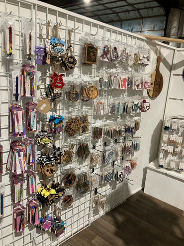 Christmas Ornaments, gel pens, suncatchers, book markers, cutting boards, and ear rings. 