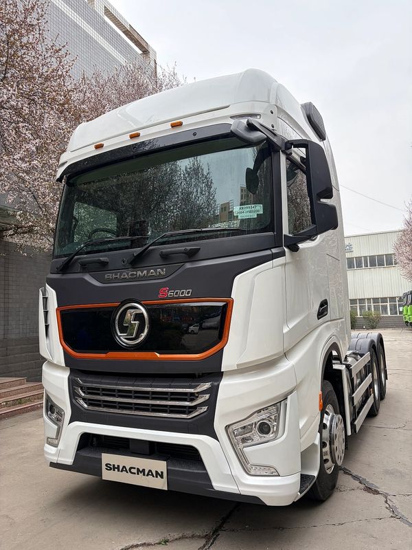 White Shacman S6000 truck parked outdoors.