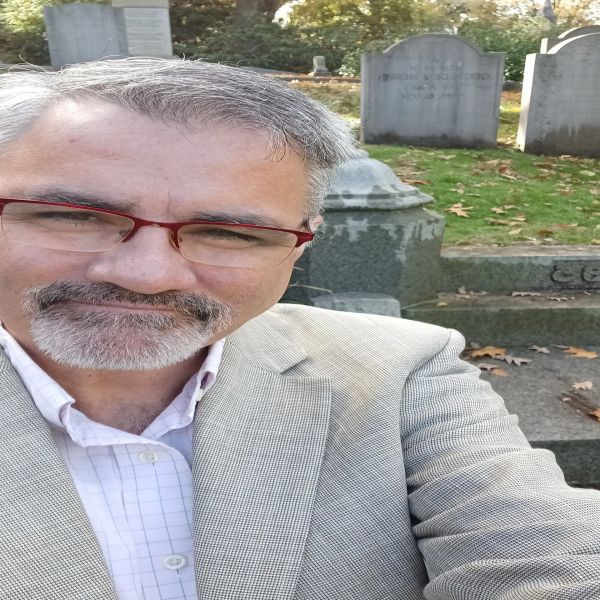 Man taking a selfie in a cemetery.