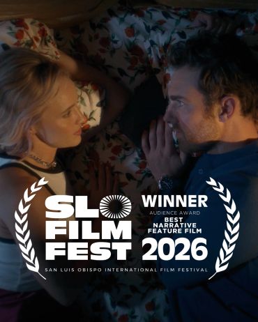 Couple lying close, intense gaze, SLO Film Fest winner 2026.