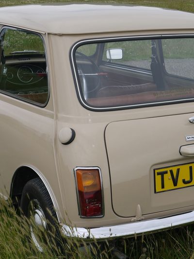 Austin Mini 1000 1970. Parked on grass at a show. In rare colour of bedouin beige.