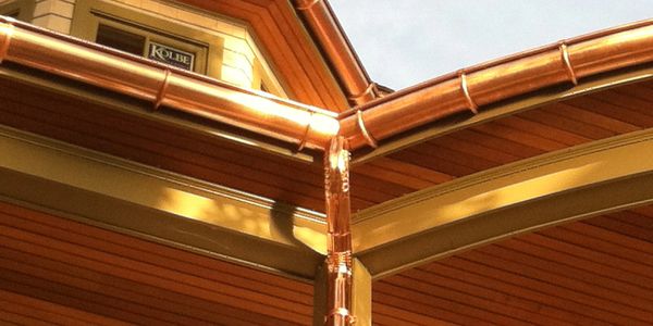 Half round copper gutters. Artwork done in corners...