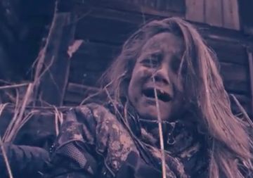 Distressed child with messy hair, covered in dirt, looking frightened.