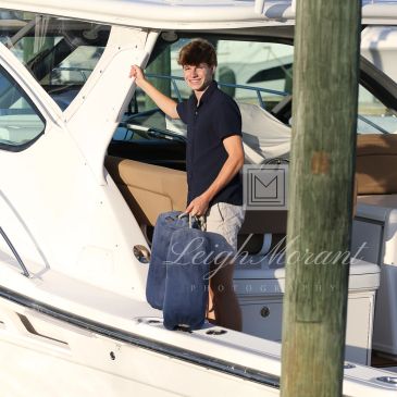 Sport fishing boat crew boy
