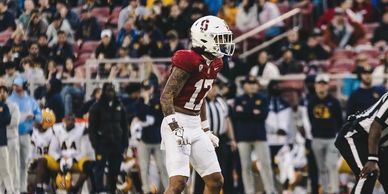 Football player standing on field during a game.