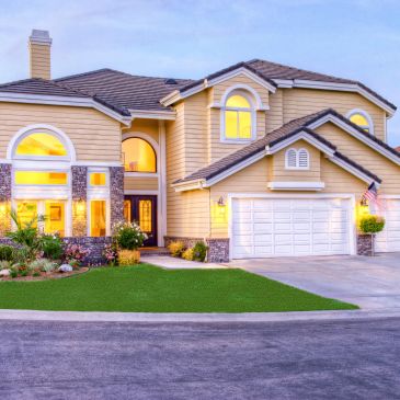 Beautiful two-story suburban house at dusk.