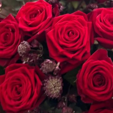 A valentine bouquet of vibrant red roses wrapped in beautiful paper and able to be delivered in Ipswich and local area of Suffolk.