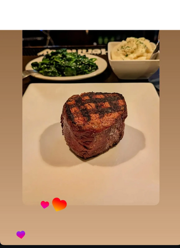 Juicy steak with garnish presented on a dining table

