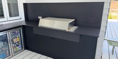 Outdoor kitchen with a Dekton benchtop and stainless-steel fittings, designed by Osborne’s Kitchens 