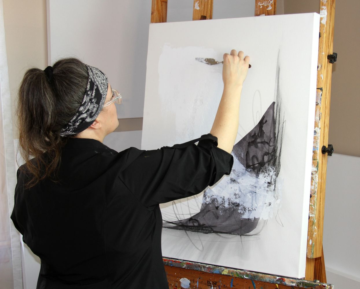 Artist Erin Leigh Boughamer as she paints  in her studio.