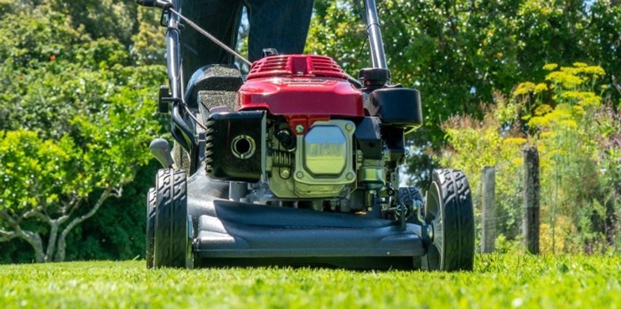 a honda lawn mower cutting grass