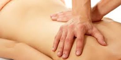 Therapist giving client a Swedish massage