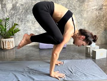 Crow pose arm balance in modern studio Koh tao