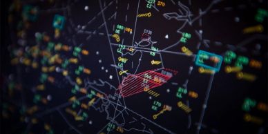 Air traffic control radar screen with aircraft data.