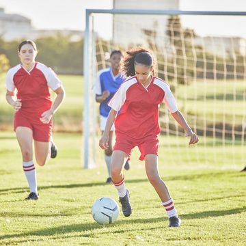 soccer girls playing with soccer ball