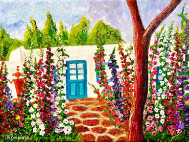 Colorful garden with tall flowers leading to a white house with a blue door.