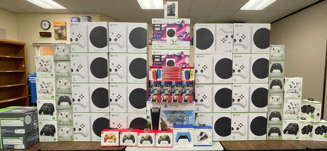 Multiple Xboxs, Nintendo Switches, and PS5s in their boxes. 