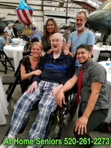 At Home Seniors caregivers celebrating a client's birthday at the Pima Air and Space Museum in Tucso