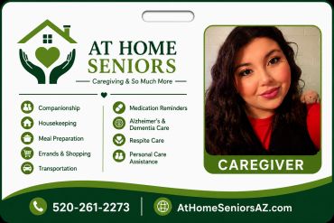 Business card for At Home Seniors caregiving services with caregiver photo.
