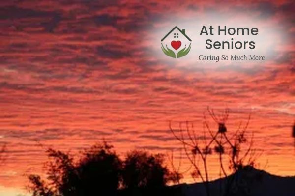 Sunset sky with logo of At Home Seniors