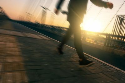 Woman striding in sunlight. Holistic Alexanmder Technique lessons can help you enjoy physical activi