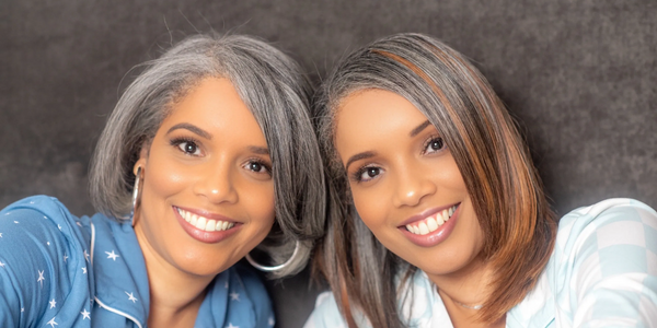 Diane and Dawn co-hosts are leaning in and smiling at the camera