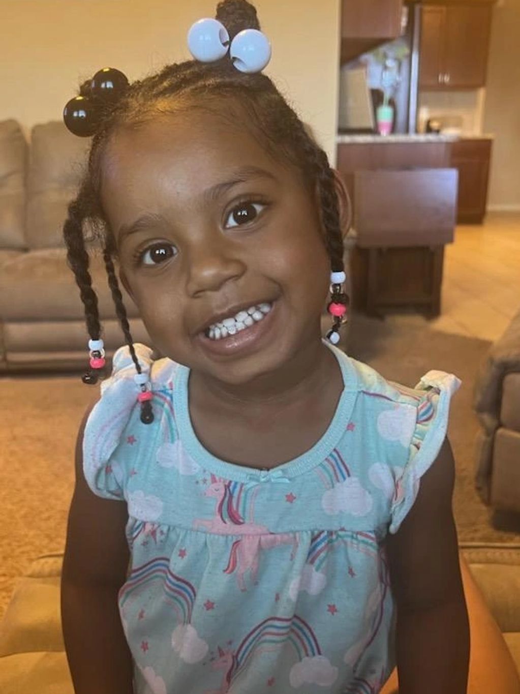 Beautiful girl smiling with braids. 