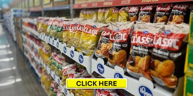 Shelves stocked with various flavors of classic potato chips in a grocery store aisle.