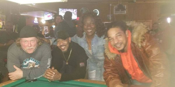 Candid shot of four close friends gazing forward