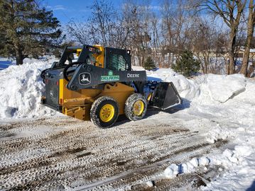 Snow Material Displacement - Skid Loader 