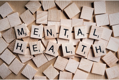Image of tiles spelling out mental health. 