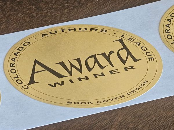 Close-up of a gold award sticker on a book.