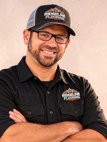 Man smiling wearing Ridgeline Flooring uniform.