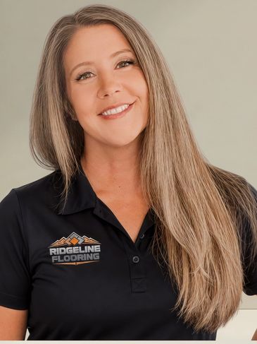 Smiling woman in a Ridgeline Flooring shirt.