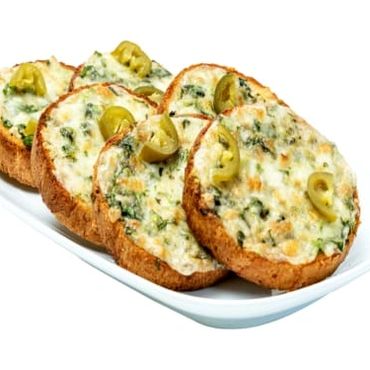Slices of cheesy garlic bread garnished with green olives on a white plate.