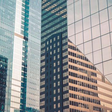 Reflection of buildings on glass skyscrapers.