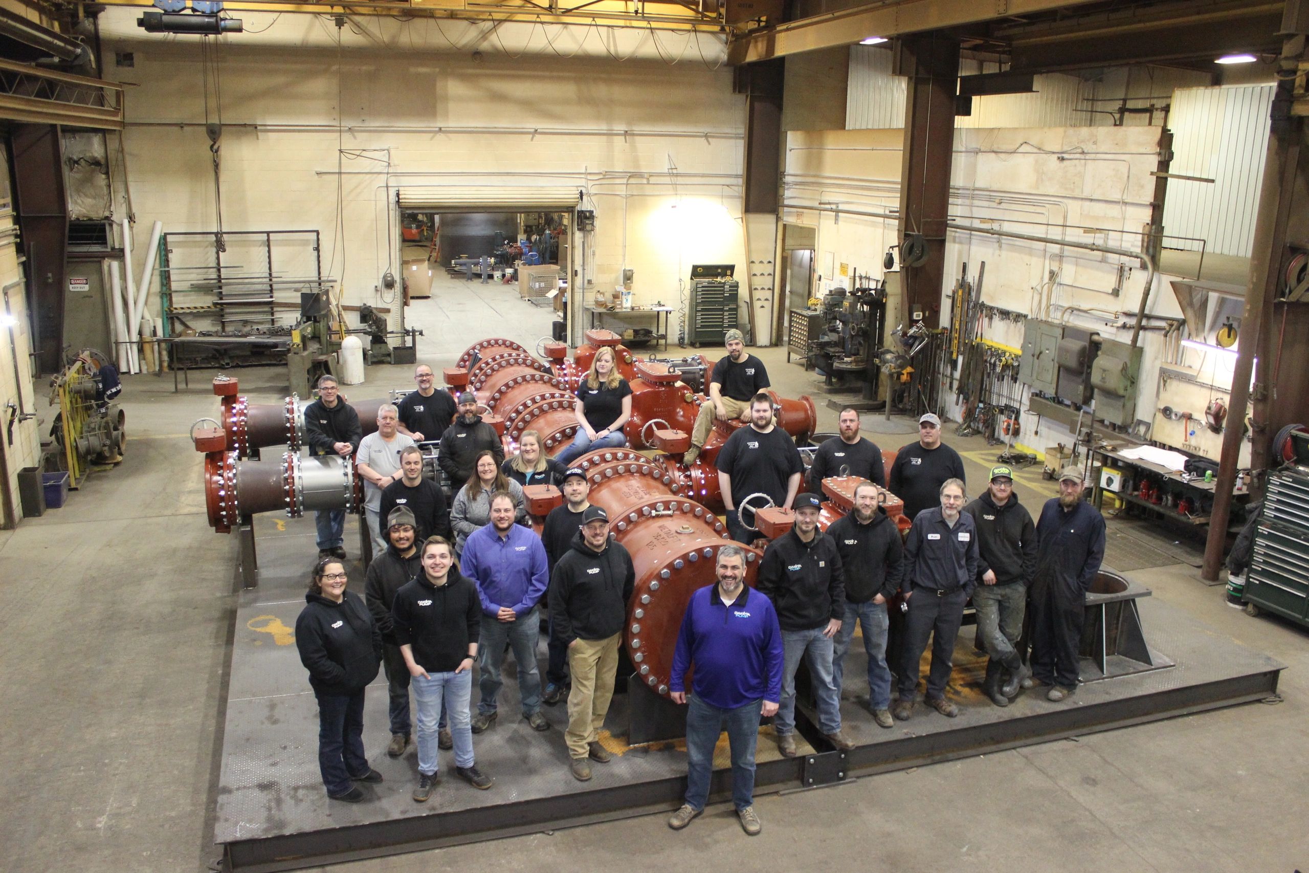 Engineered water management systems technicians and engineers in the Dakota Pump shop