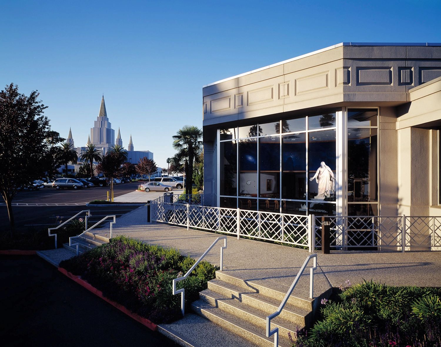 Oakland Temple Visitors' Center and FamilySearch Library; Oakland California Temple in background.