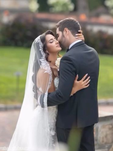 Newlywed couple sharing an intimate moment.