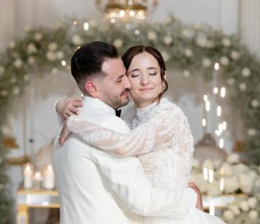 Couple embracing on their wedding day.