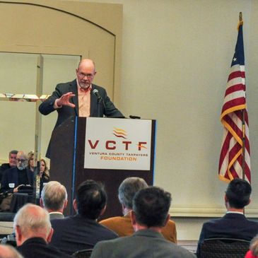 Picture of Jon Coupal speaking at a VCTF event. 
