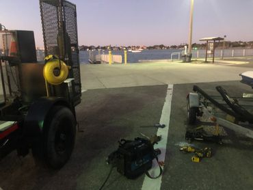 Emergency on-site repair of a damaged boat trailer. 