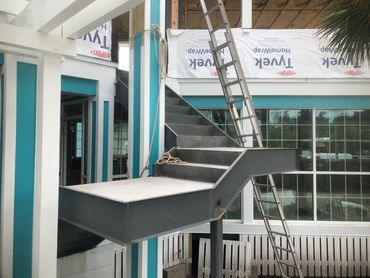 Custom restaurant staircase fabrication and installation. 