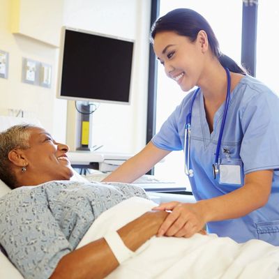 Nurse Talking To Female Patient