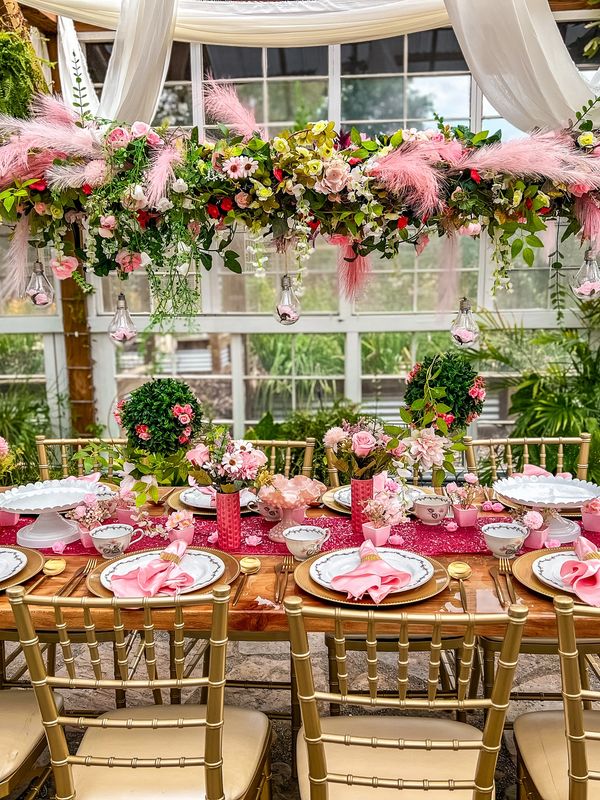 Pink themed luxury picnic in the greenhouse