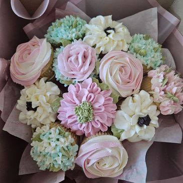 A bouquet of intricately decorated flower cupcakes.