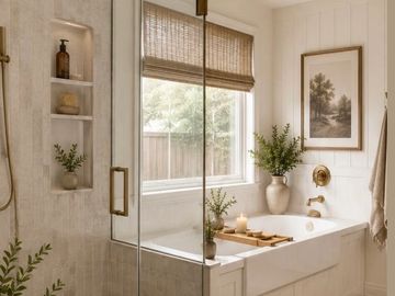 Elegant bathroom with toilet and tub  with beautiful green plant