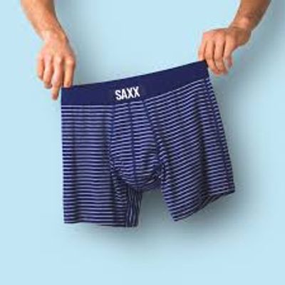 A man holding a pair of Canadian men's underwear brand SAXX 